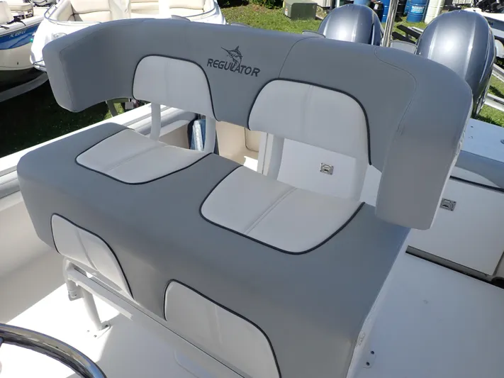  Yacht Photos Pics 2020 Regulator 23 boat seating with gray and white cushioned design.