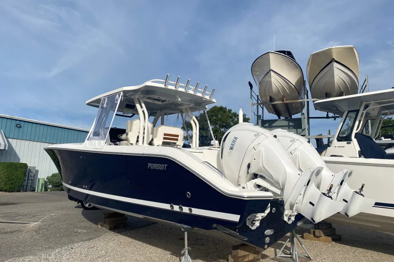  Yacht Photos Pics 2024 Pursuit S 328 Sport boat with dual Yamaha engines, displayed outdoors.