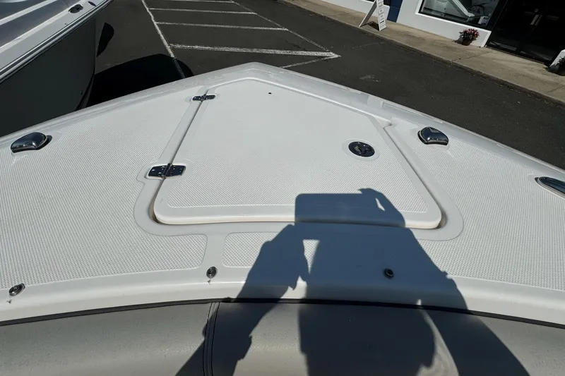  Yacht Photos Pics 2024 Pursuit S 328 Sport boat deck with storage hatch and hardware.
