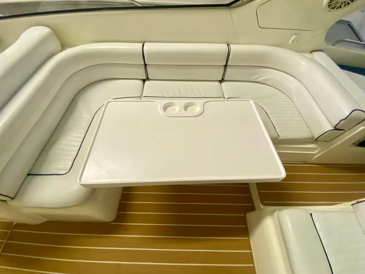 Tude Yacht Photos Pics Interior seating and table of a 1995 Sunseeker Apache 45 boat.