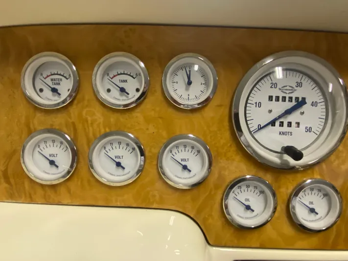 Tude Yacht Photos Pics Dashboard gauges of a 1995 Sunseeker Apache 45 boat, including speedometer and tank indicators.