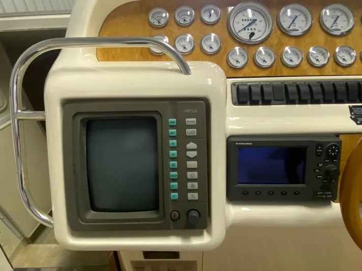 Tude Yacht Photos Pics Sunseeker Apache 45 1995 boat dashboard with gauges and navigation equipment.