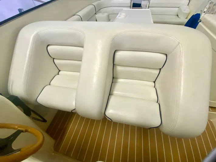 Tude Yacht Photos Pics Interior seating of a 1995 Sunseeker Apache 45 boat with white leather upholstery.