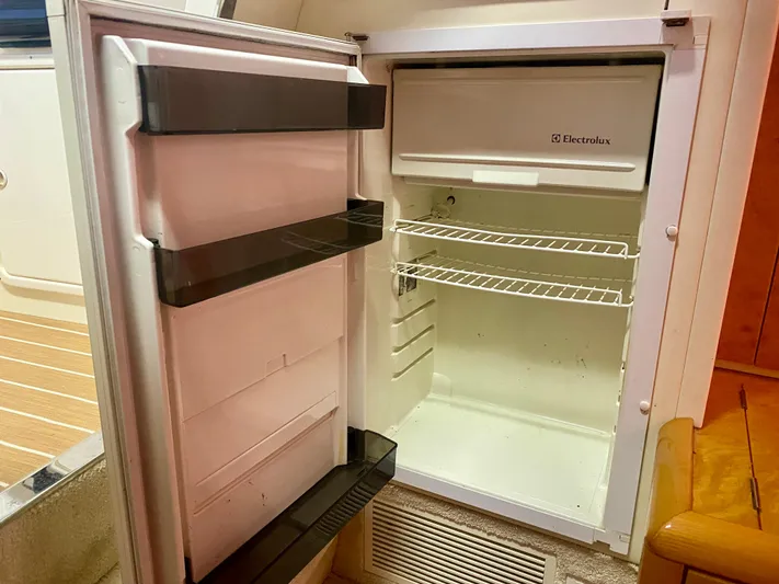 Tude Yacht Photos Pics Open Electrolux refrigerator inside a 1995 Sunseeker Apache 45 boat.