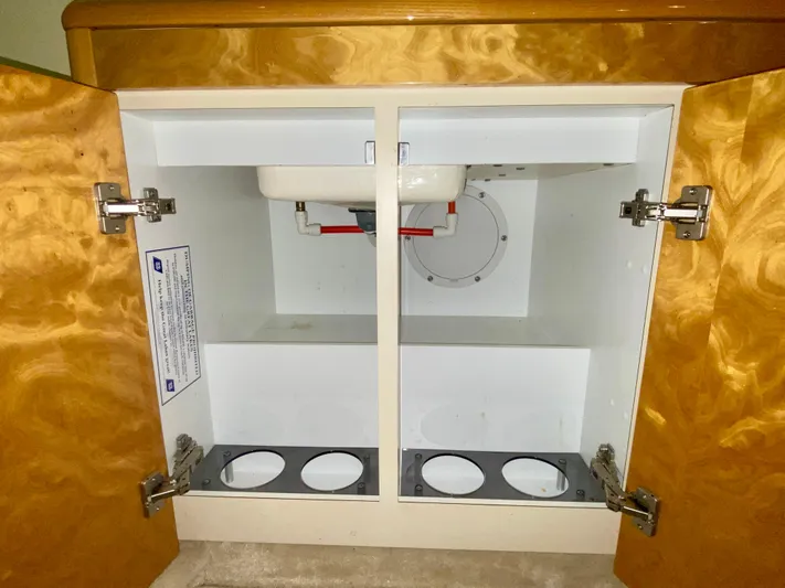 Tude Yacht Photos Pics Open cabinet under sink in 1995 Sunseeker Apache 45 boat.