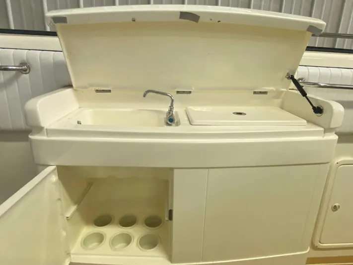 Tude Yacht Photos Pics 1995 Sunseeker Apache 45 boat sink and storage compartment.