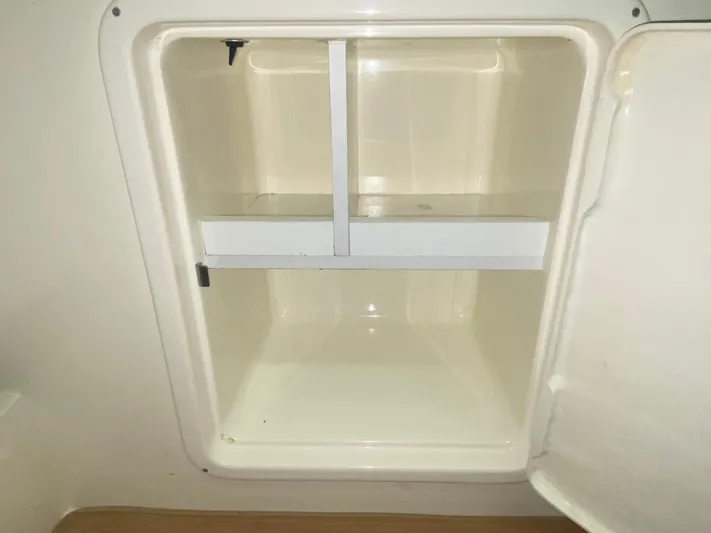 Tude Yacht Photos Pics Storage compartment inside a 1995 Sunseeker Apache 45 boat.