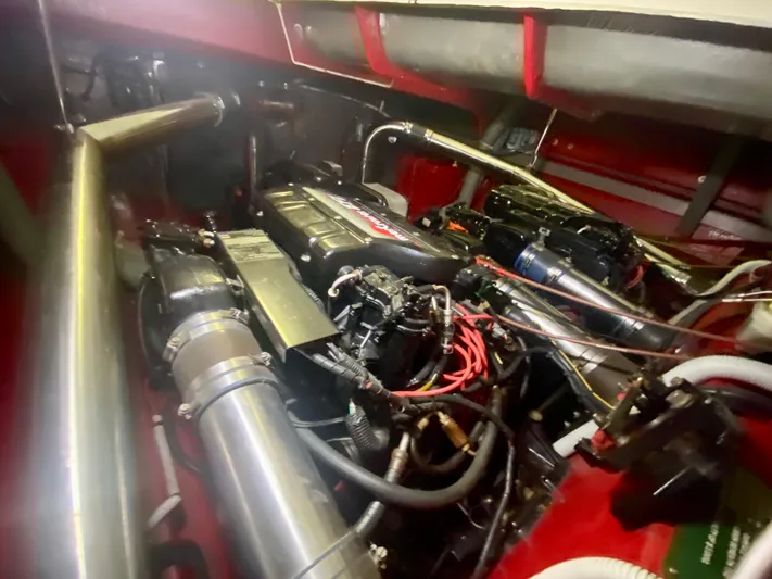 Tude Yacht Photos Pics Engine compartment of a 1995 Sunseeker Apache 45 boat, showcasing mechanical components.