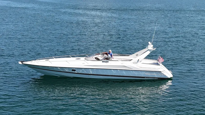 Tude Yacht Photos Pics 1995 Sunseeker Apache 45 yacht cruising on open water.