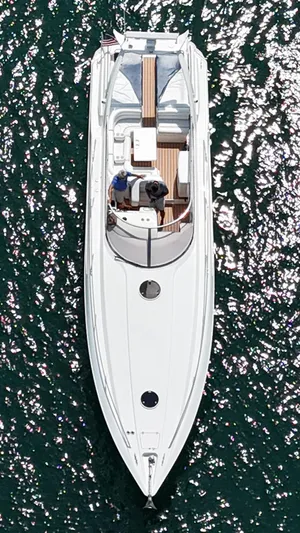 Tude Yacht Photos Pics Aerial view of 1995 Sunseeker Apache 45 yacht on sparkling water.