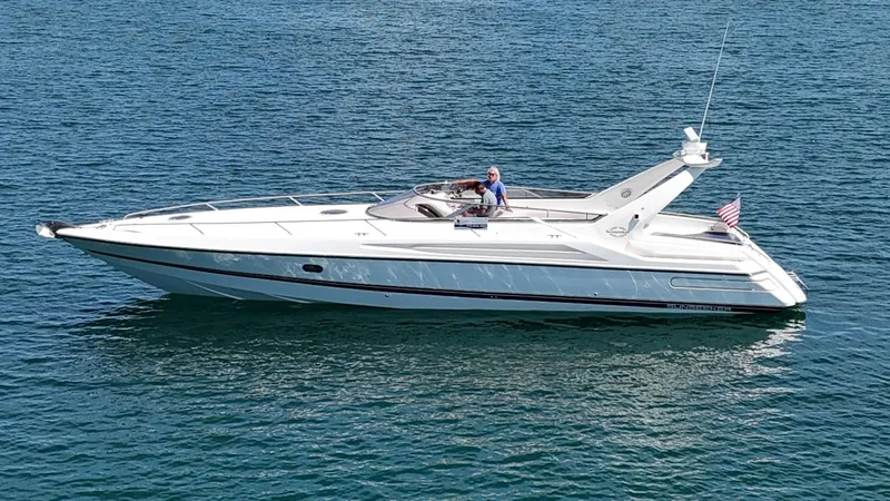 Tude Yacht Photos Pics 1995 Sunseeker Apache 45 yacht cruising on blue water.