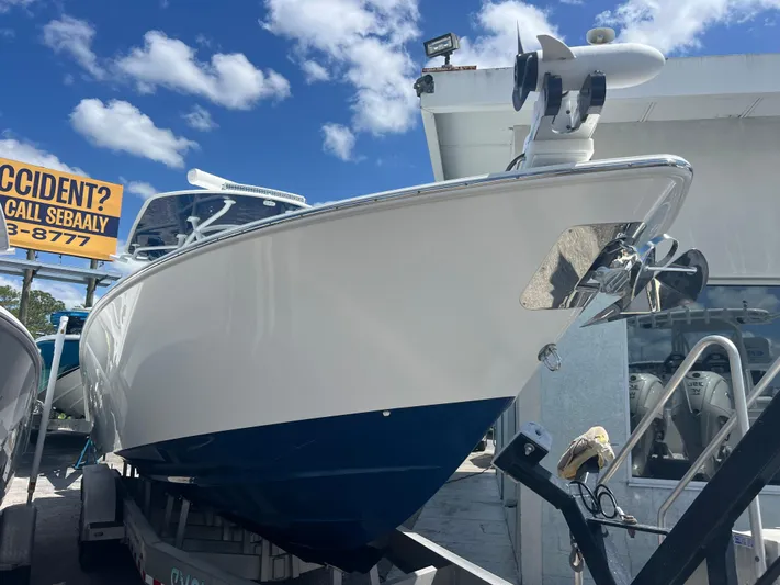  Yacht Photos Pics 2019 Contender 32 ST boat on trailer under blue sky.
