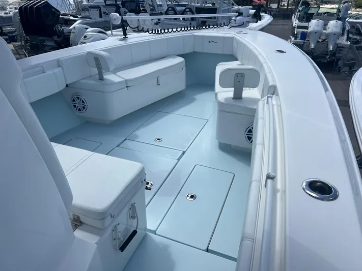  Yacht Photos Pics 2019 Contender 32 ST boat interior with seating and storage compartments.