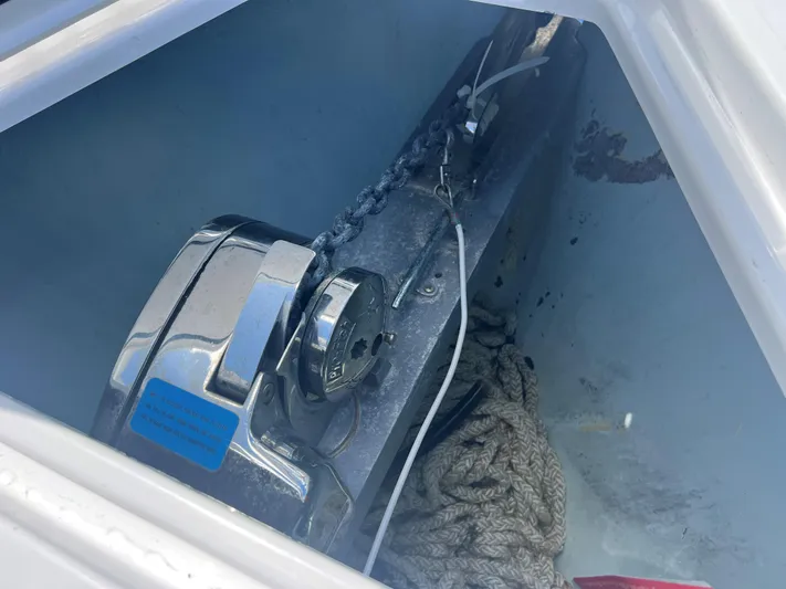  Yacht Photos Pics Anchor winch and rope in a 2019 Contender 32 ST boat compartment.