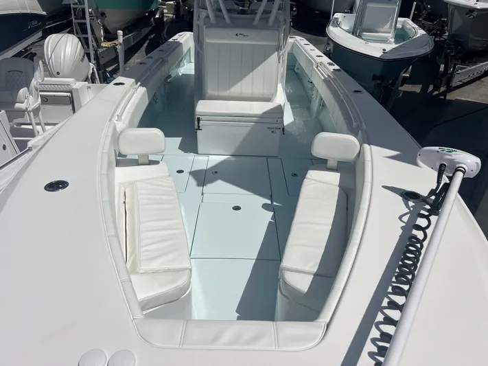  Yacht Photos Pics 2019 Contender 32 ST boat with white seating and spacious deck layout.
