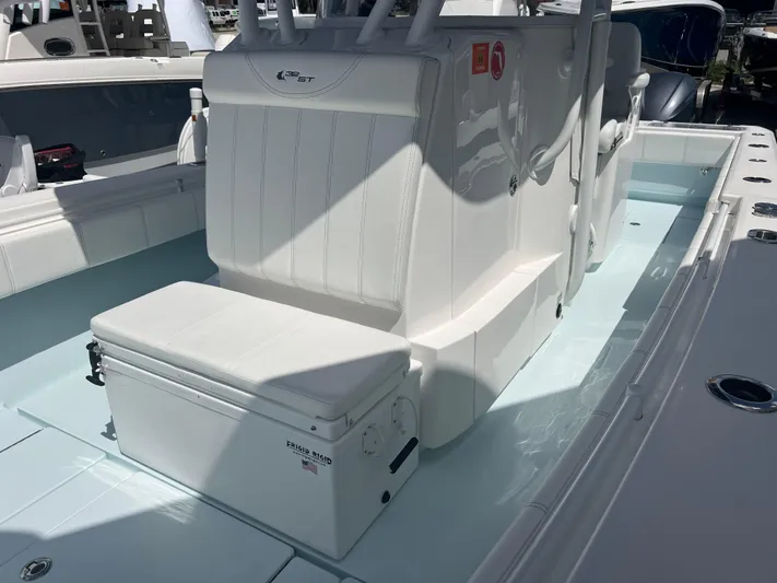  Yacht Photos Pics 2019 Contender 32 ST boat interior with seating and storage, featuring sleek white design.