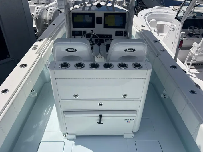  Yacht Photos Pics 2019 Contender 32 ST boat cockpit with dual seats and control panel.