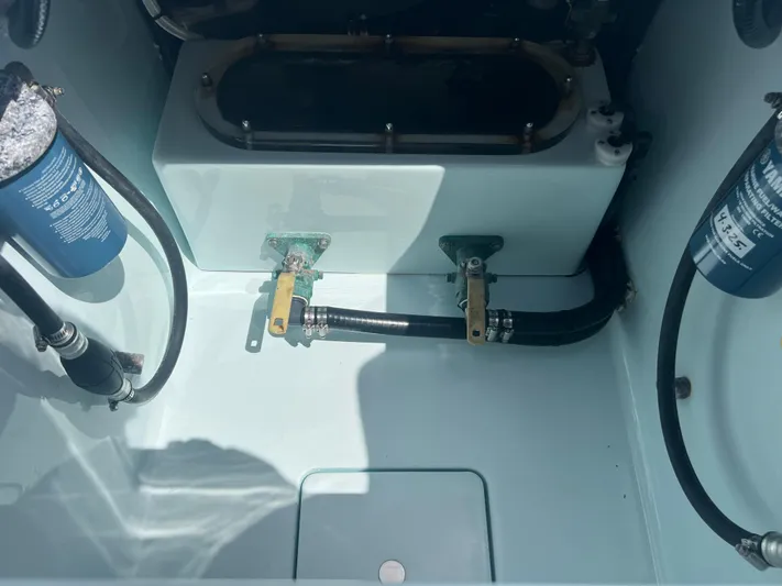  Yacht Photos Pics 2019 Contender 32 ST boat engine compartment with hoses and filters.