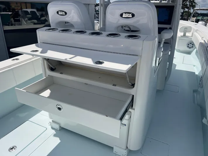  Yacht Photos Pics 2019 Contender 32 ST boat with open storage compartments on deck.