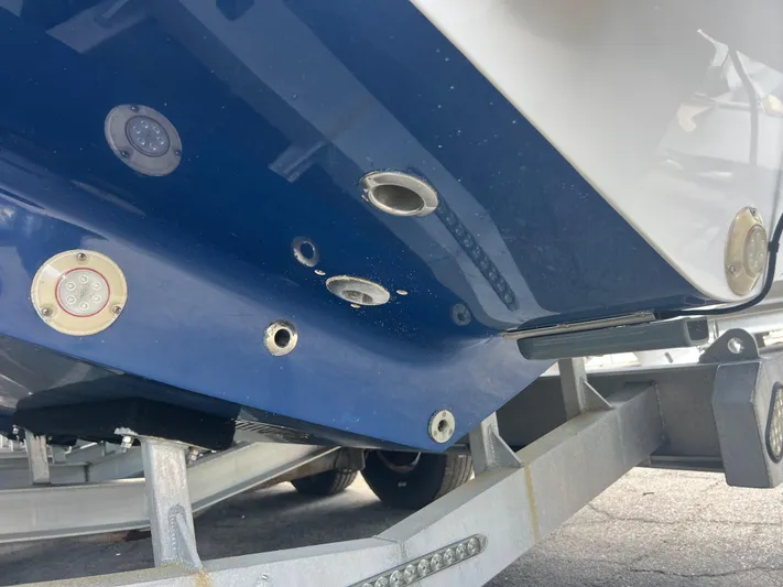  Yacht Photos Pics 2019 Contender 32 ST boat hull on trailer, showing underwater lights and fittings.