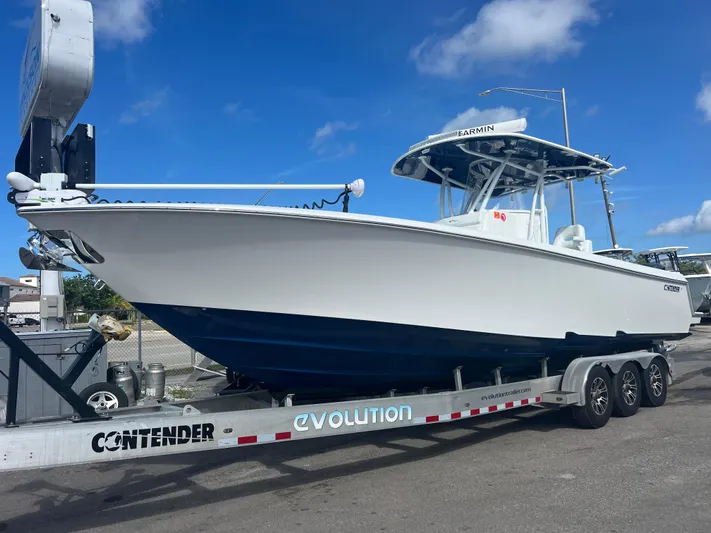  Yacht Photos Pics 2019 Contender 32 ST boat on trailer under blue sky.