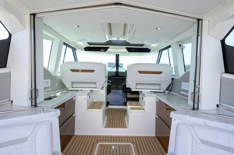  Yacht Photos Pics 2022 Tiara Yachts 43 LE interior with modern seating and sleek design.