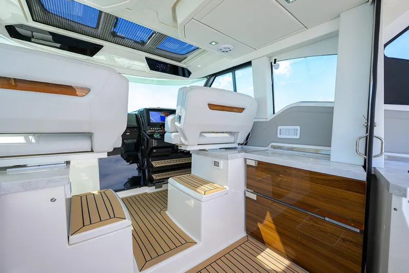  Yacht Photos Pics Interior of 2022 Tiara Yachts 43 LE, featuring luxurious seating and modern design.