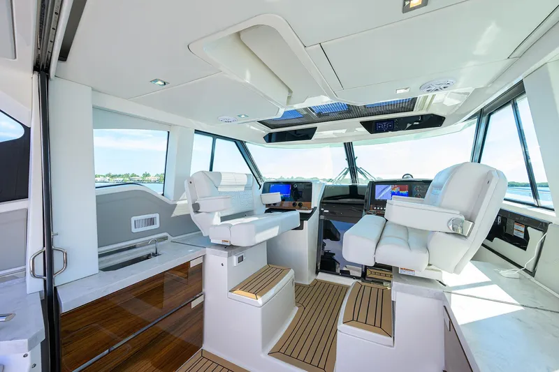  Yacht Photos Pics Interior of 2022 Tiara Yachts 43 LE, featuring modern helm and luxurious seating.