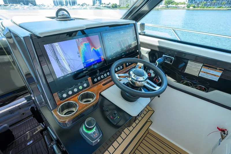  Yacht Photos Pics 2022 Tiara Yachts 43 LE helm with advanced navigation displays and controls.