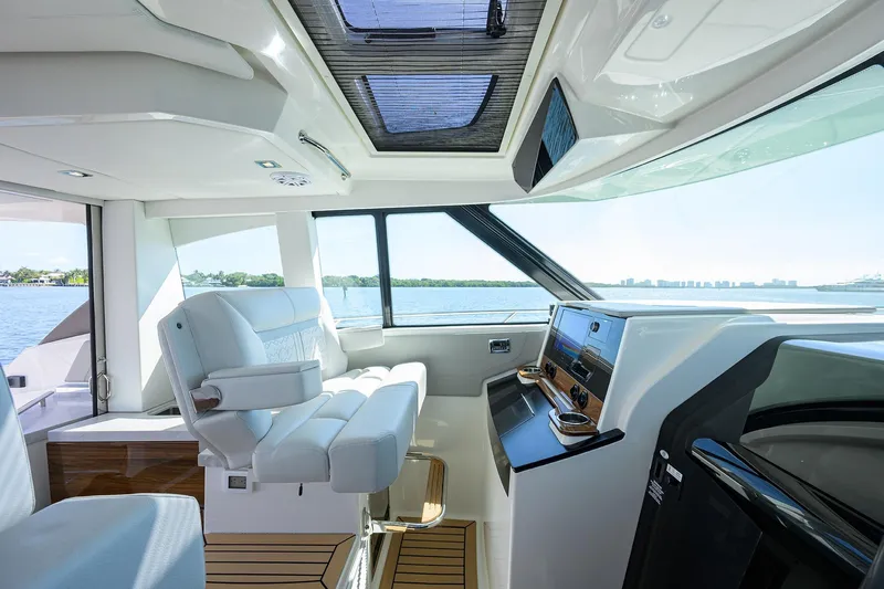 Yacht Photos Pics 2022 Tiara Yachts 43 LE interior with modern helm and panoramic water views.