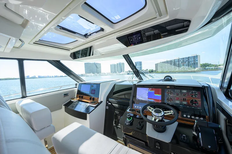  Yacht Photos Pics Interior of 2022 Tiara Yachts 43 LE, featuring modern navigation and control systems.
