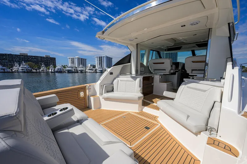  Yacht Photos Pics Luxurious 2022 Tiara Yachts 43 LE with spacious seating and elegant design on the water.