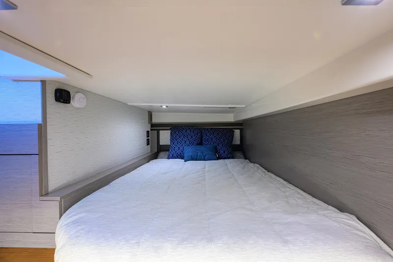  Yacht Photos Pics Interior cabin of 2022 Tiara Yachts 43 LE with cozy bed and modern design.