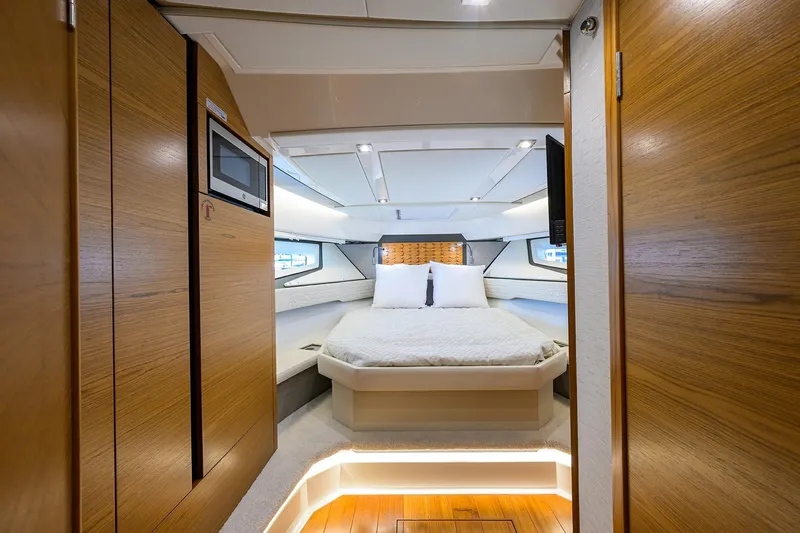  Yacht Photos Pics Luxurious interior of 2022 Tiara Yachts 43 LE with cozy bed and modern design.