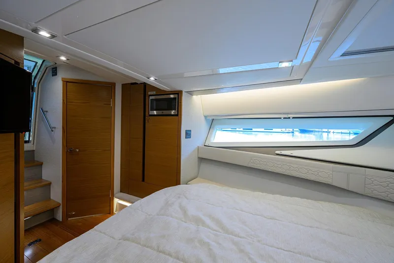  Yacht Photos Pics Luxurious interior of 2022 Tiara Yachts 43 LE, featuring modern design and elegant wood finishes.
