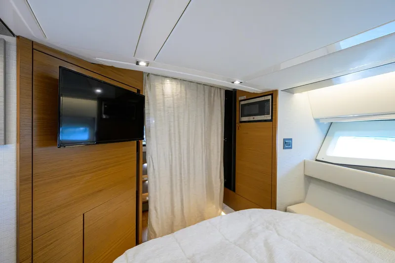  Yacht Photos Pics Interior of 2022 Tiara Yachts 43 LE, featuring a TV, microwave, and modern design.