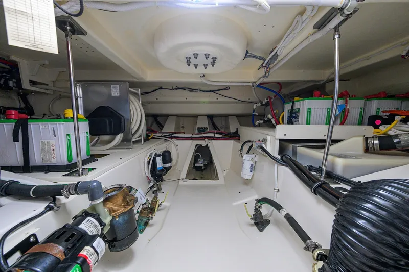  Yacht Photos Pics Engine room of 2022 Tiara Yachts 43 LE, showcasing batteries and wiring.