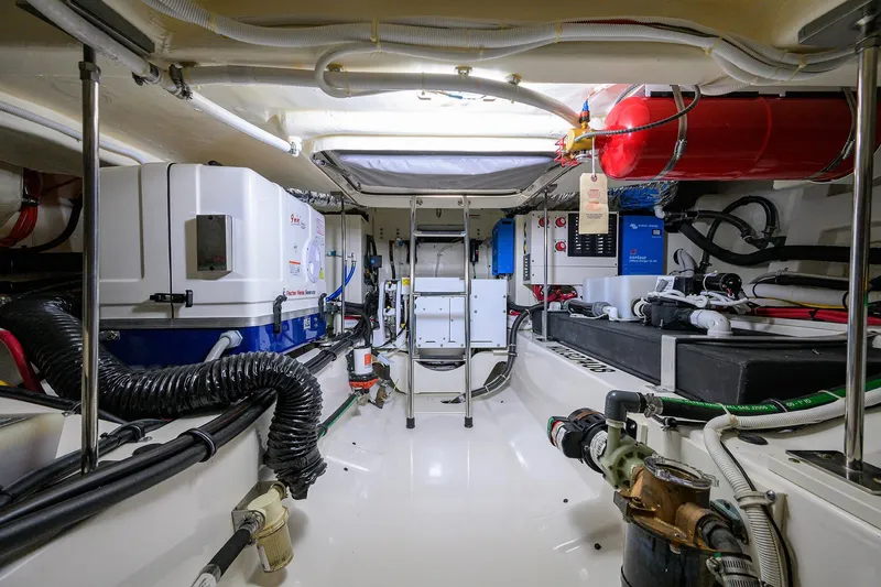  Yacht Photos Pics Engine room of 2022 Tiara Yachts 43 LE, showcasing equipment and wiring.