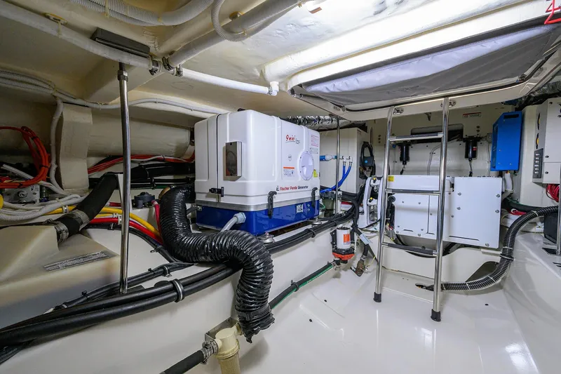  Yacht Photos Pics Engine room of 2022 Tiara Yachts 43 LE, featuring advanced equipment and wiring.