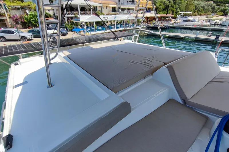  Yacht Photos Pics Luxurious 2023 Bali 4.2 yacht with spacious sunbathing area at marina.