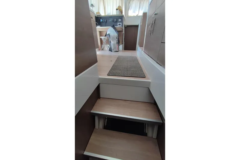  Yacht Photos Pics Interior stairs of 2023 Bali 4.2 yacht, featuring modern design and wooden finish.