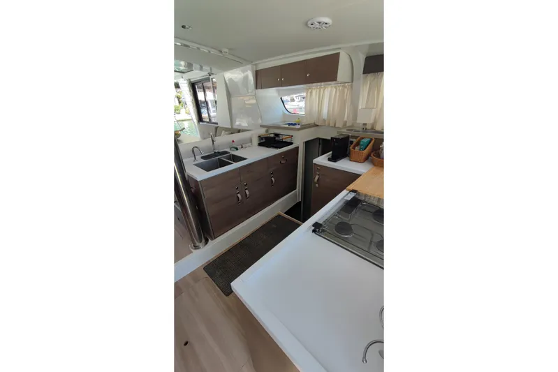  Yacht Photos Pics Modern kitchen interior of 2023 Bali 4.2 yacht with sleek countertops and appliances.