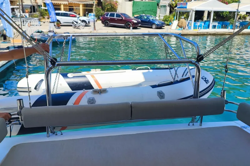  Yacht Photos Pics 2023 Bali 4.2 yacht with inflatable boat docked in a marina.