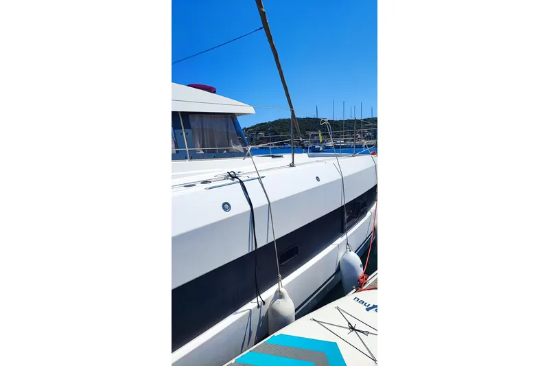  Yacht Photos Pics 2023 Bali 4.2 yacht docked under clear blue sky.