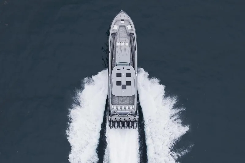  Yacht Photos Pics Aerial view of 2026 Deep Impact 499 Sport boat cruising on water.