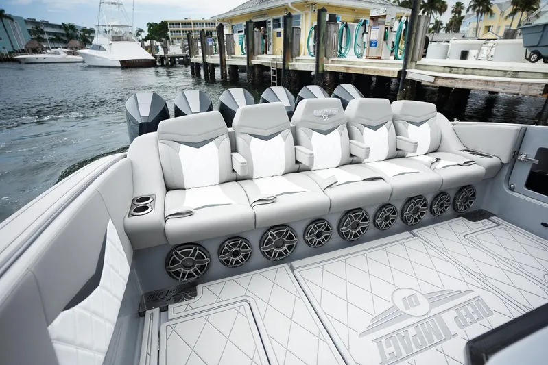  Yacht Photos Pics Luxury seating on 2026 Deep Impact 499 Sport boat, docked at marina.