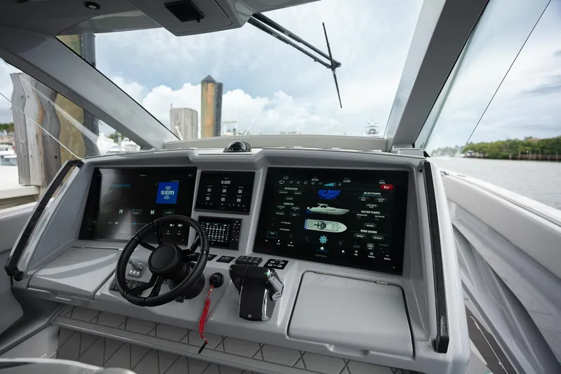  Yacht Photos Pics Cockpit of 2026 Deep Impact 499 Sport boat with advanced navigation displays.