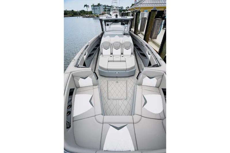  Yacht Photos Pics Luxurious 2026 Deep Impact 499 Sport boat interior with elegant seating and modern design.