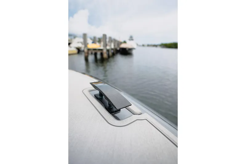  Yacht Photos Pics Close-up of 2026 Deep Impact 499 Sport boat cleat by the dock.