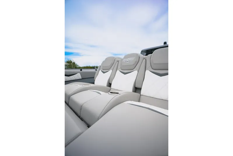  Yacht Photos Pics Luxurious seating in 2026 Deep Impact 499 Sport boat, featuring elegant gray and white upholstery.
